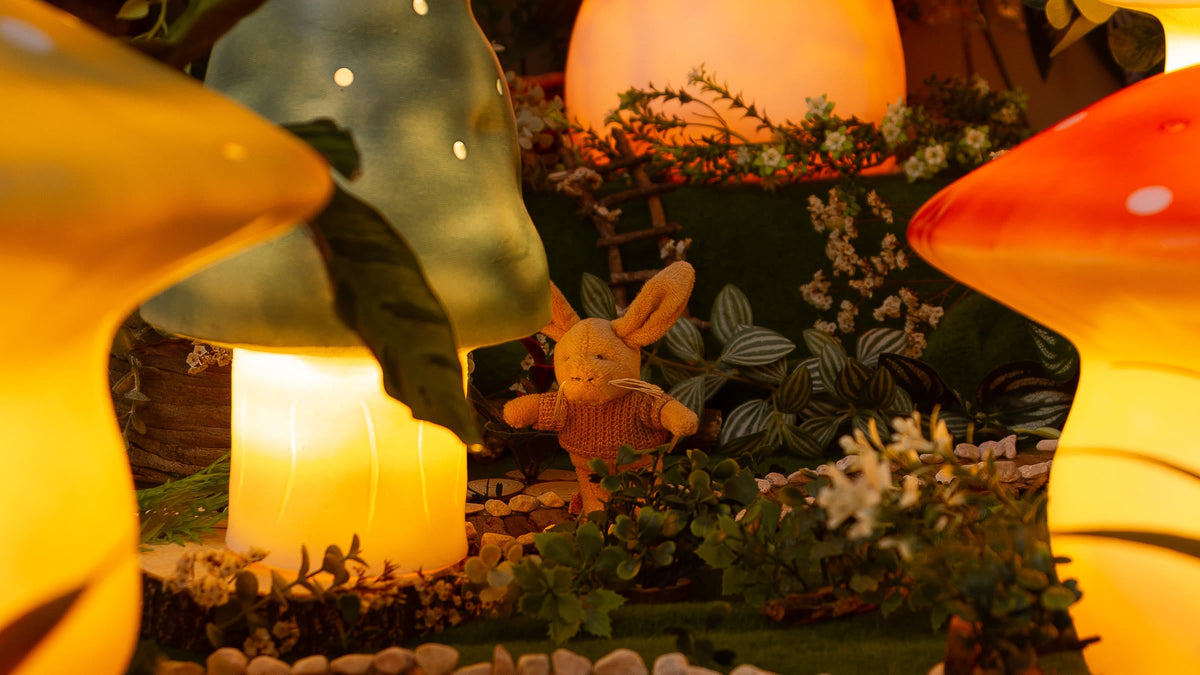 Lenny the rabbit walks home between the glowing mushroom lamps