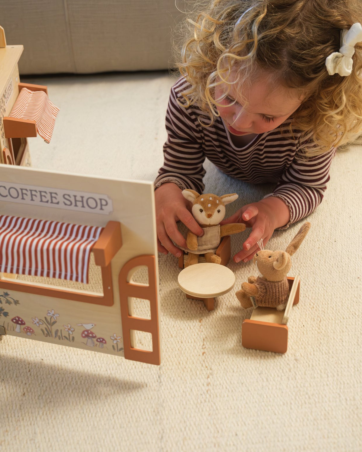 A girl at the coffee house and bakery with the miniatures
