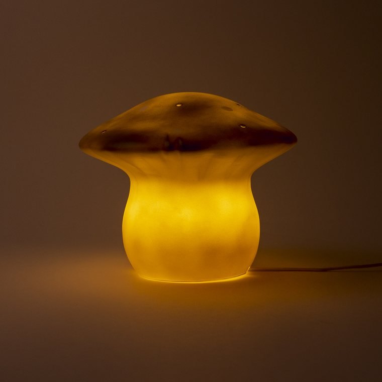 The medium mushroom lamp in Bronze Brown, switched on