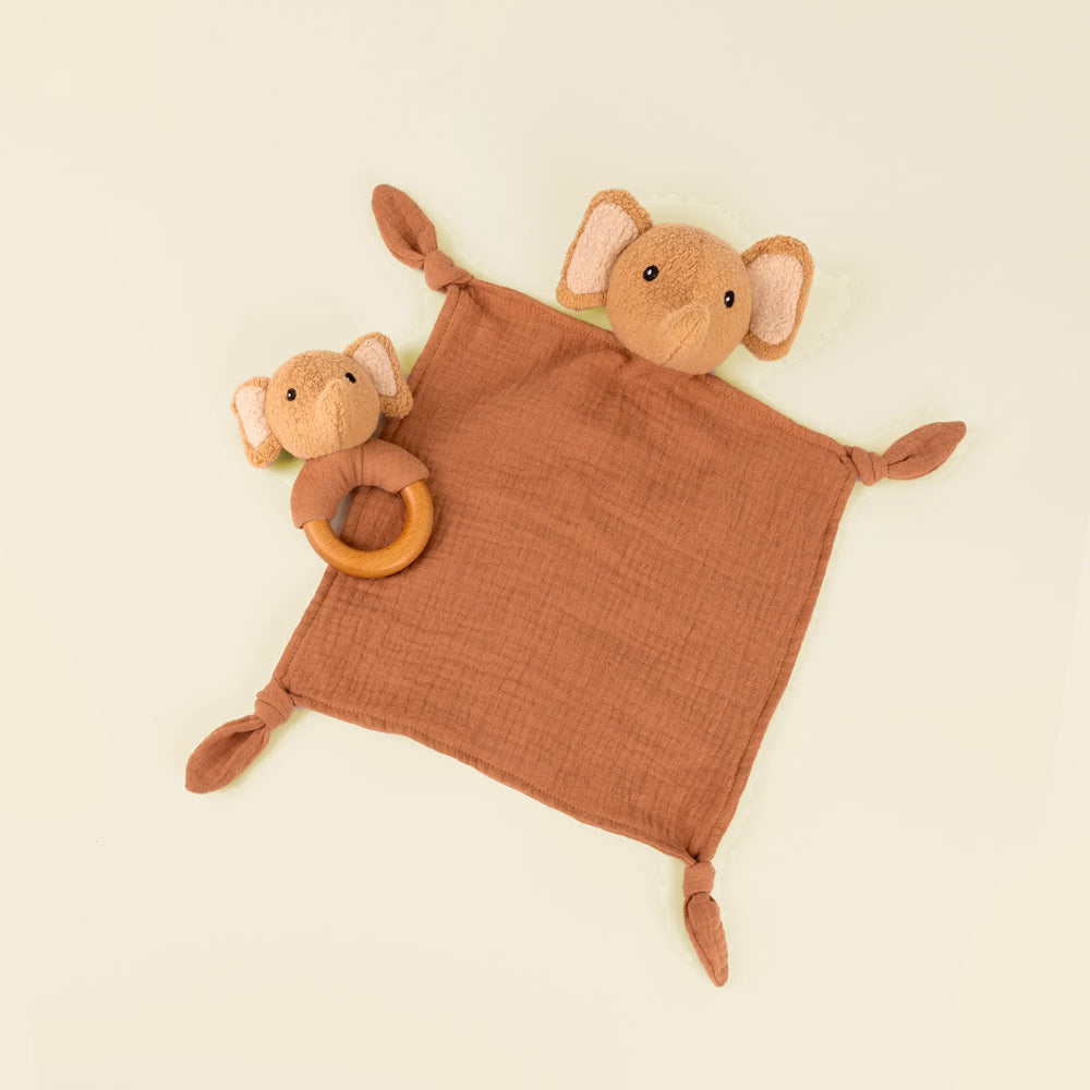 Elephant Ollie doudou and rattle on pale sand