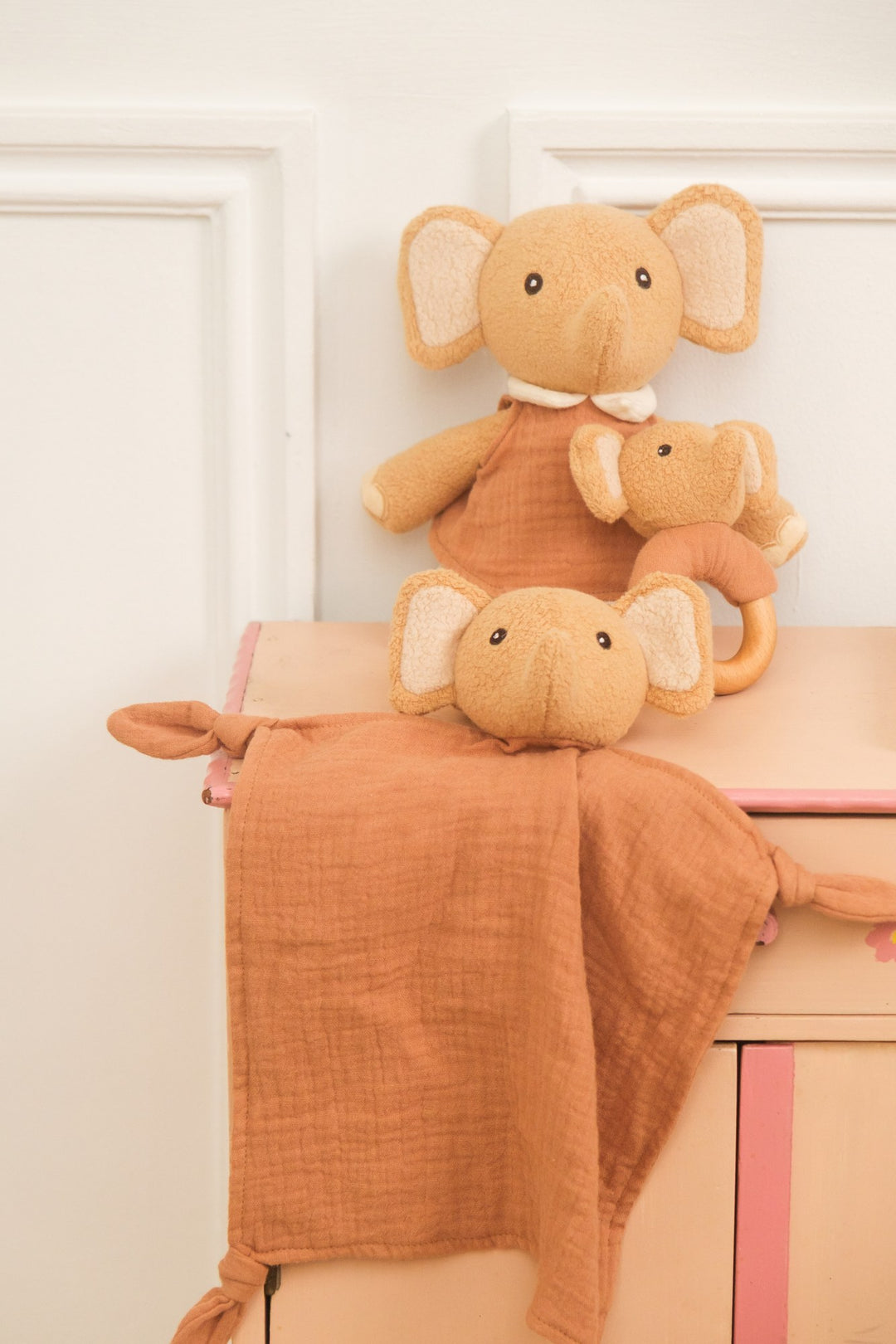 Ollie elephant doudou and rattle styled on dresser