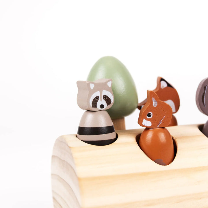 FOREST ANIMALS IN A LOG