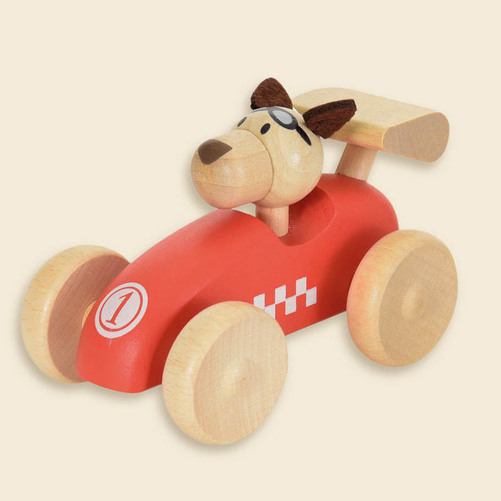 Wooden race car with dog driver