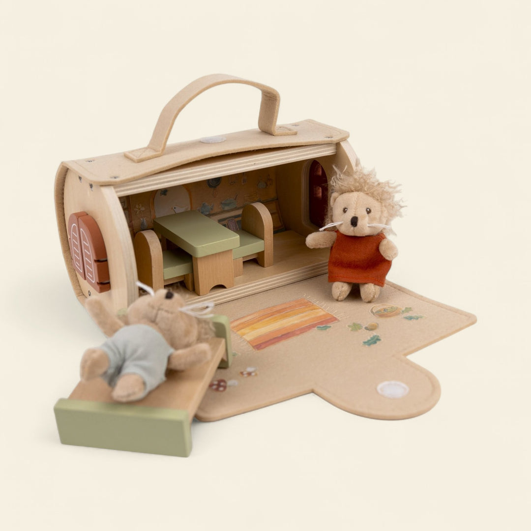 Log house with miniature friends