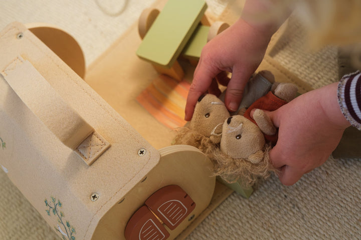 Log house with miniature friends