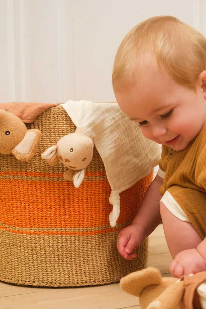 Leonie giraffe doudou styled in basket