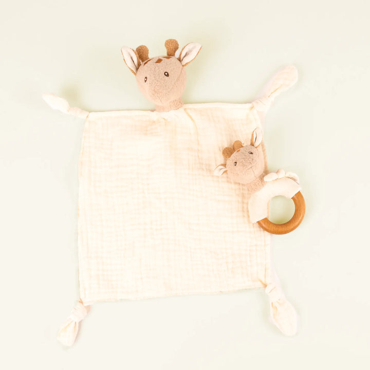Leonie giraffe doudou and rattle on pale sand